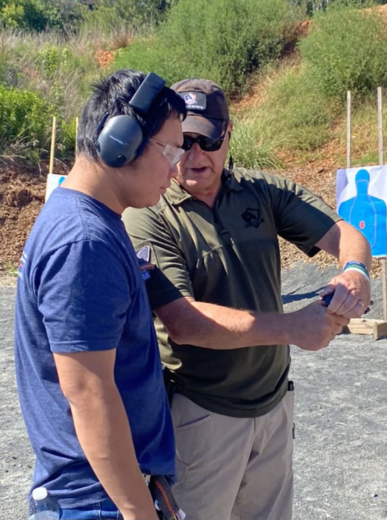 Two men in the gun range discussing