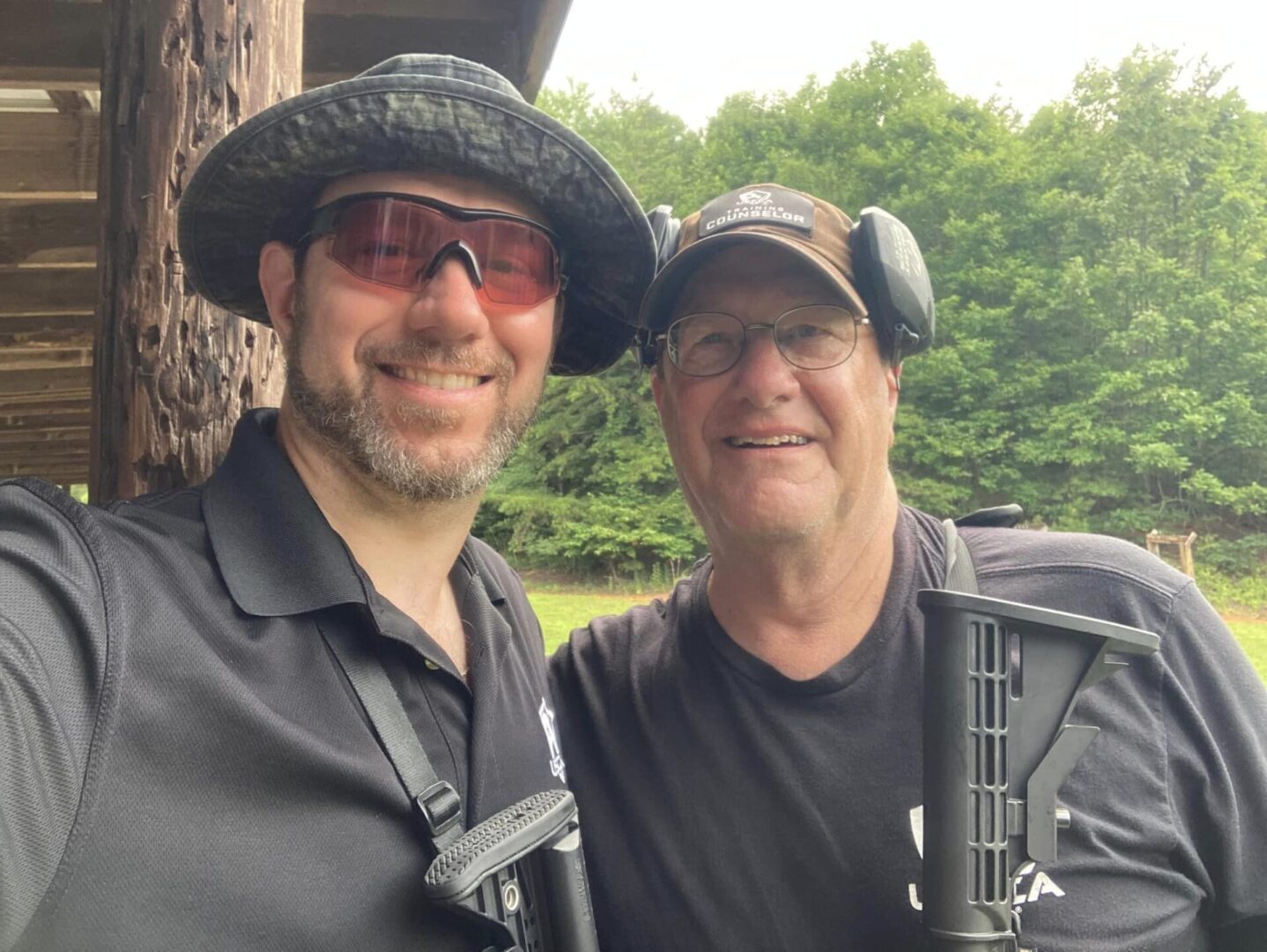 Two men in the shooting range taking a selfie