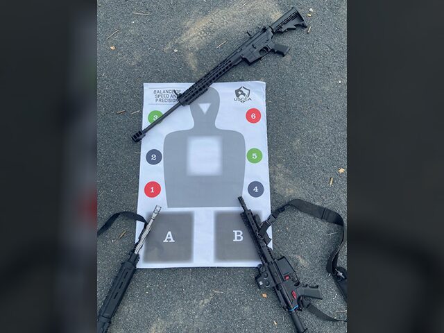 A gun and a target on the ground